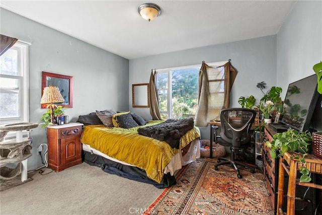 bedroom featuring light carpet