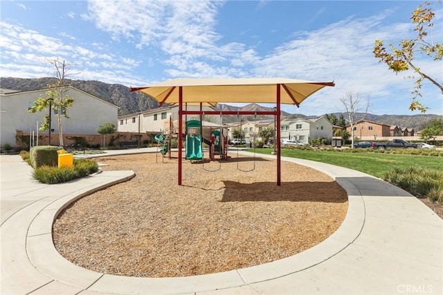 community jungle gym with a mountain view and a residential view