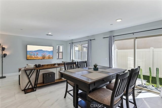 dining space with recessed lighting, visible vents, and baseboards