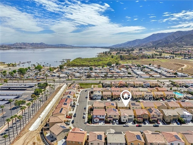 bird's eye view featuring a residential view and a water and mountain view