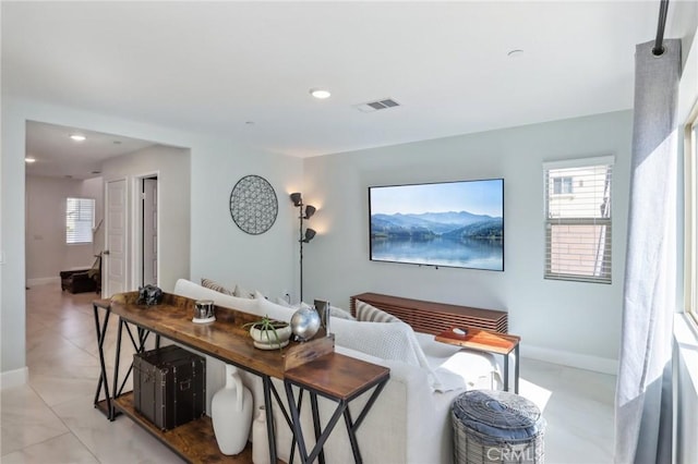 interior space featuring recessed lighting, visible vents, baseboards, and light tile patterned floors