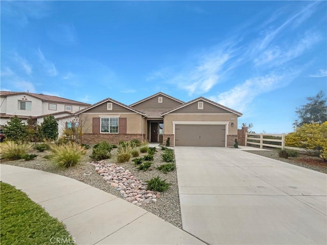 ranch-style house with a garage, driveway, fence, and brick siding