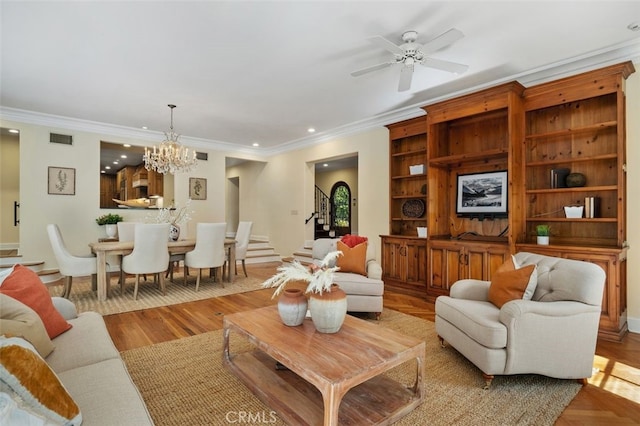 living area with stairway, recessed lighting, visible vents, and crown molding