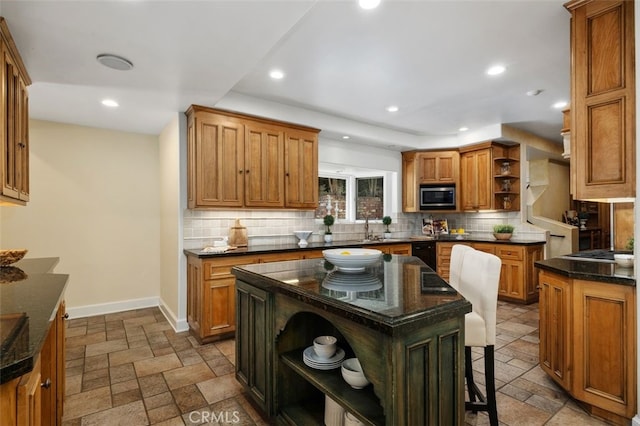 kitchen with stone tile floors, baseboards, decorative backsplash, stainless steel microwave, and open shelves