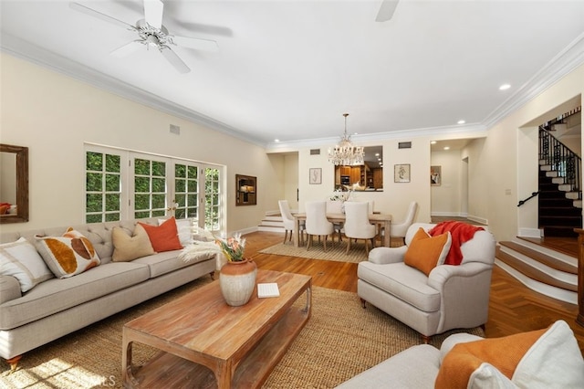 living area featuring recessed lighting, ceiling fan with notable chandelier, stairs, parquet floors, and crown molding