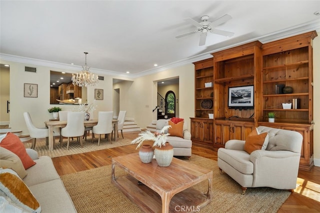 living room featuring stairway, recessed lighting, visible vents, and ornamental molding