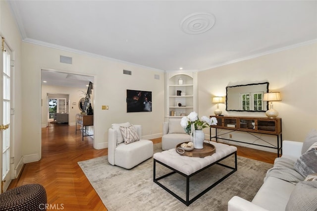 living room with ornamental molding, baseboards, visible vents, and built in features