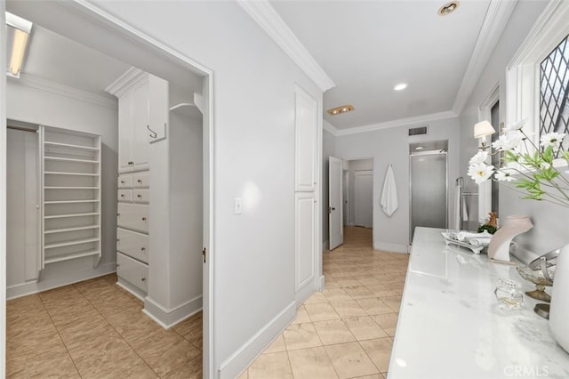 hall with ornamental molding, recessed lighting, visible vents, and baseboards