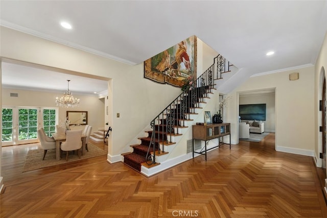 interior space with ornamental molding, visible vents, baseboards, and an inviting chandelier