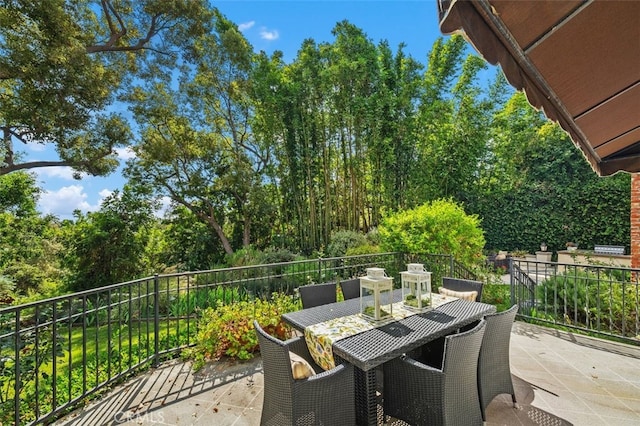 view of patio featuring outdoor dining area