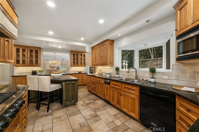 kitchen with black dishwasher, stainless steel microwave, brown cabinets, a sink, and recessed lighting