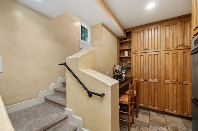 stairway with stone tile flooring