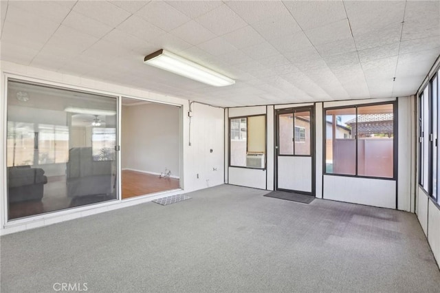carpeted empty room with ceiling fan
