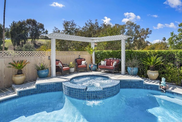 view of pool featuring a pool with connected hot tub and a fenced backyard