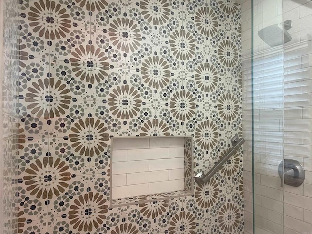 bathroom with a tile shower