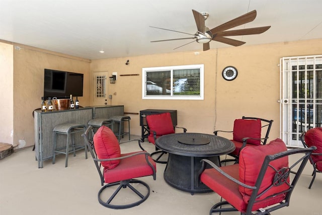 view of patio featuring outdoor dry bar and ceiling fan