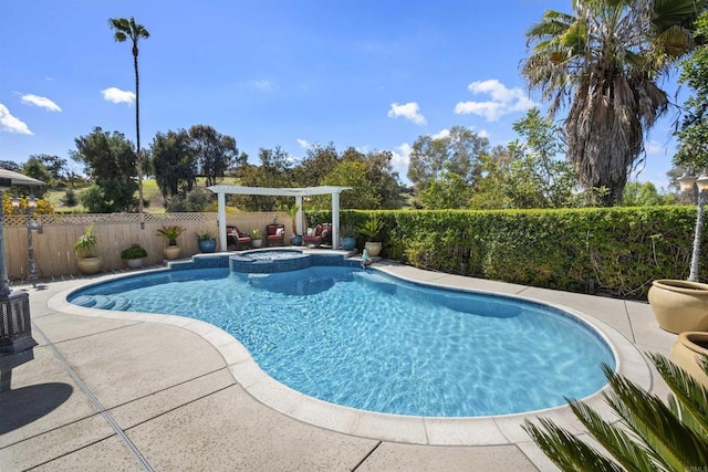 view of pool featuring a patio area, a pool with connected hot tub, and a fenced backyard