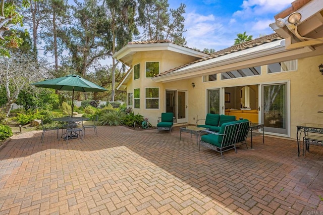 view of patio / terrace with an outdoor hangout area and outdoor dining space