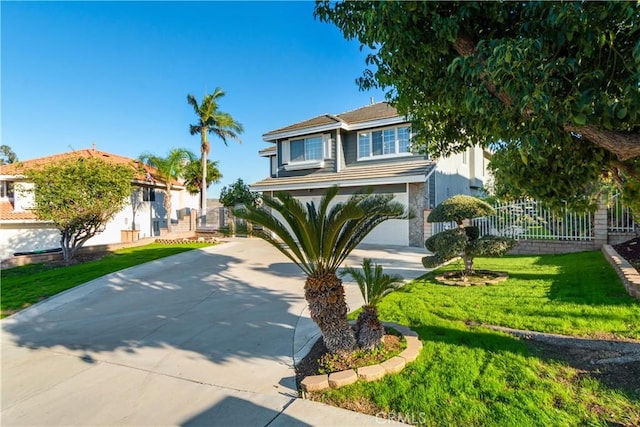 view of front of property featuring driveway, a front yard, and fence