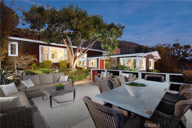 view of patio featuring outdoor dining area and an outdoor living space