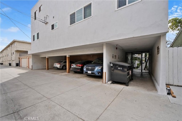 view of parking featuring fence