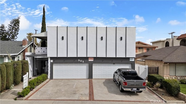 322 N Isabel St Unit 9, Glendale, CA 91206 - townhome / multi-family property featuring driveway, a balcony, an attached garage, and fence