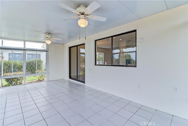 interior space with ceiling fan