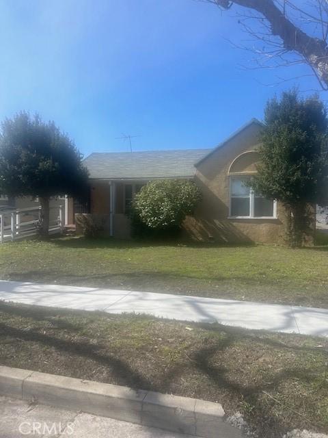 view of property exterior with a lawn