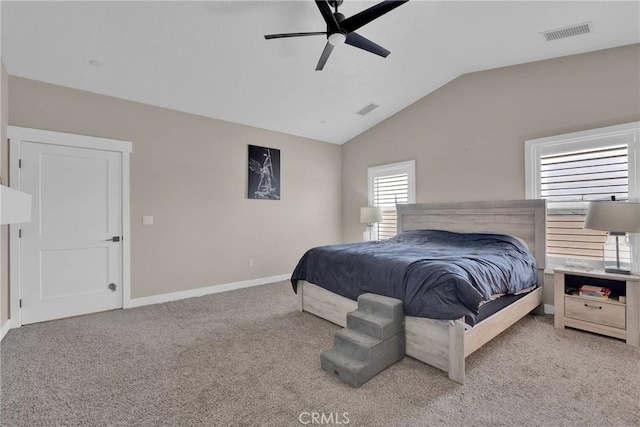 bedroom featuring vaulted ceiling, carpet floors, visible vents, and baseboards