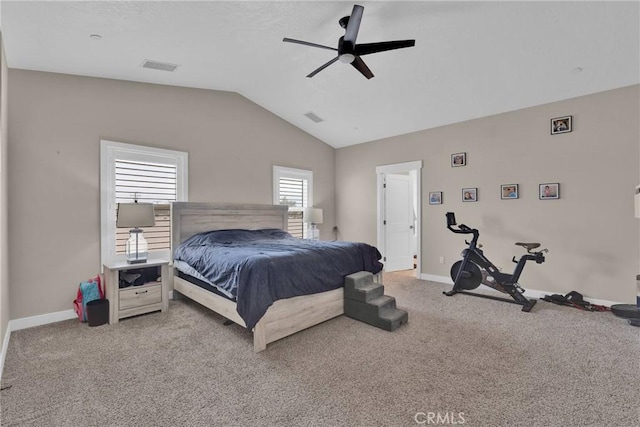 bedroom featuring light carpet, vaulted ceiling, and visible vents