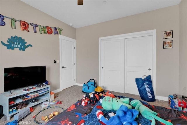 recreation room featuring baseboards and carpet flooring