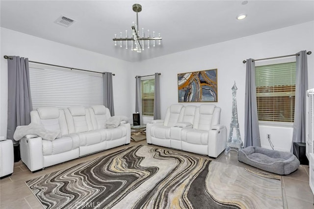 living room with recessed lighting, visible vents, and an inviting chandelier