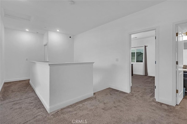 spare room featuring baseboards, carpet flooring, and recessed lighting