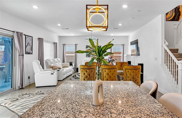 tiled dining area featuring recessed lighting, visible vents, stairway, and baseboards