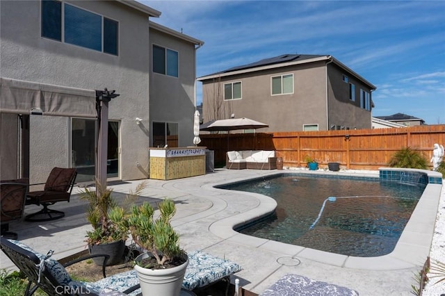 view of swimming pool featuring outdoor lounge area, a patio area, a fenced backyard, and a fenced in pool