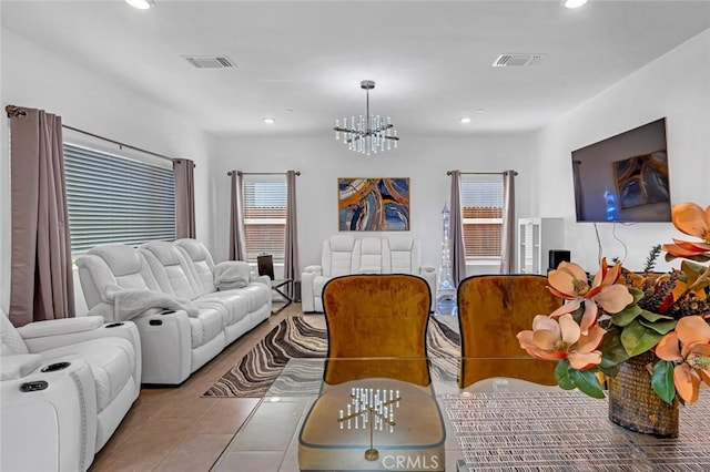 living area with recessed lighting, visible vents, a notable chandelier, and tile patterned floors