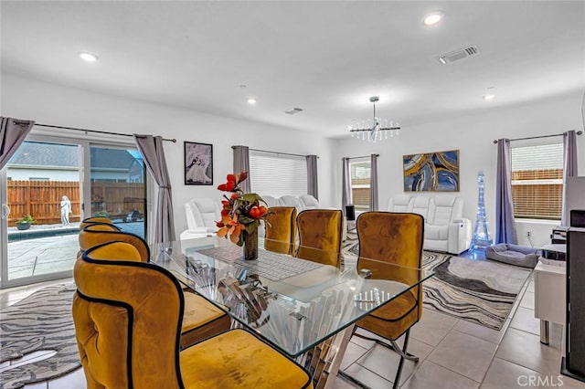 tiled dining room with visible vents, a chandelier, and recessed lighting