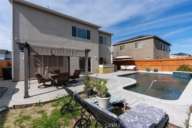 back of property with a patio, a fenced backyard, a fenced in pool, a pergola, and stucco siding