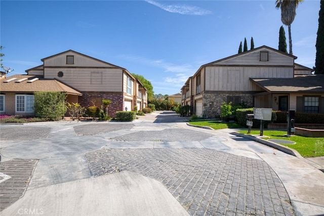 view of street with a residential view and curbs