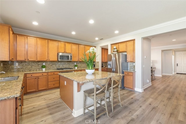 25499 Foxglove Ln, Corona, CA 92883 - kitchen featuring light stone counters, a center island, tasteful backsplash, a sink, and stainless steel appliances