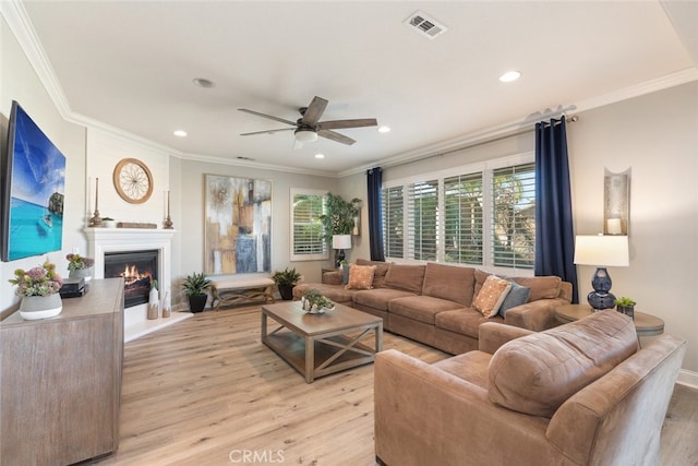 25499 Foxglove Ln, Corona, CA 92883 - living room featuring visible vents, recessed lighting, light wood-style floors, a ceiling fan, and crown molding