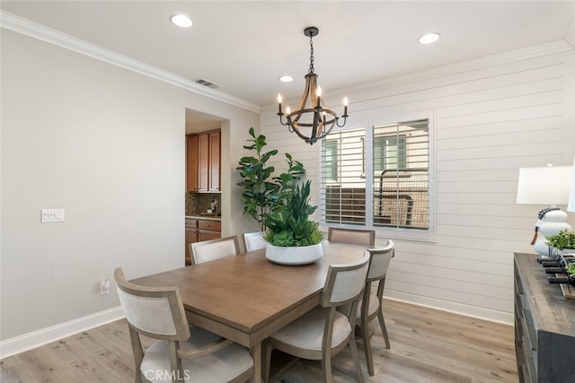 25499 Foxglove Ln, Corona, CA 92883 - dining area with an inviting chandelier, light wood finished floors, baseboards, ornamental molding, and visible vents
