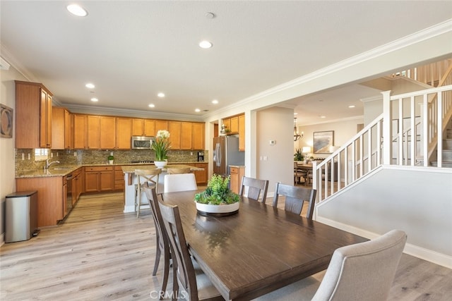 25499 Foxglove Ln, Corona, CA 92883 - dining space featuring stairway, crown molding, light wood finished floors, and recessed lighting