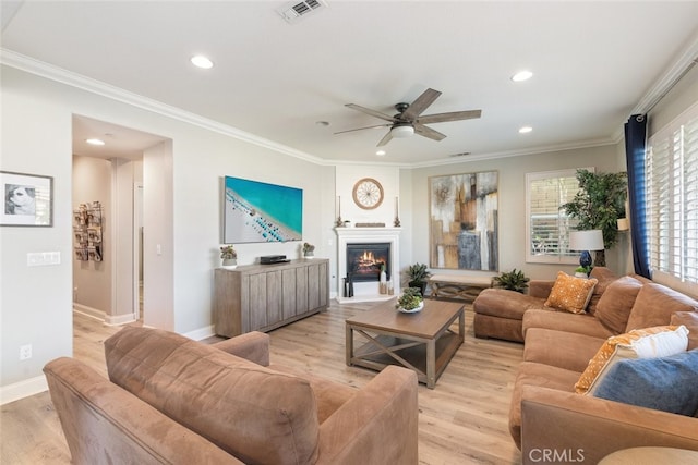 25499 Foxglove Ln, Corona, CA 92883 - living room featuring recessed lighting, light wood-style flooring, visible vents, and crown molding