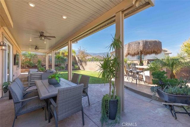 25499 Foxglove Ln, Corona, CA 92883 - view of patio / terrace featuring a fenced backyard, outdoor dining space, and a ceiling fan