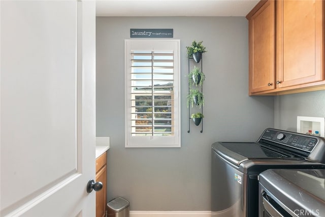 25499 Foxglove Ln, Corona, CA 92883 - laundry area with baseboards, independent washer and dryer, and cabinet space