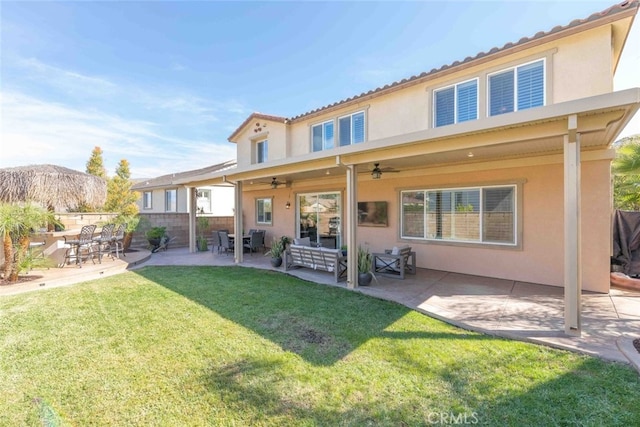 25499 Foxglove Ln, Corona, CA 92883 - rear view of property with fence, ceiling fan, a yard, a patio, and stucco siding