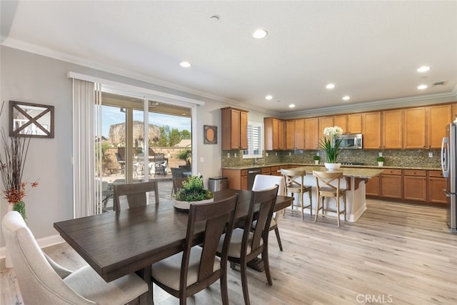 25499 Foxglove Ln, Corona, CA 92883 - dining area featuring recessed lighting, crown molding, visible vents, and light wood-type flooring