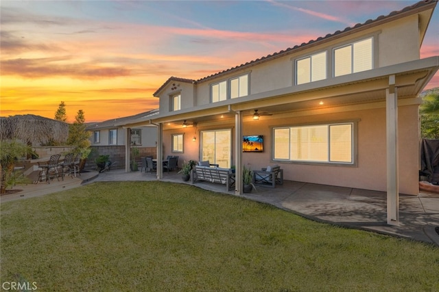 25499 Foxglove Ln, Corona, CA 92883 - back of property with stucco siding, a yard, and a patio