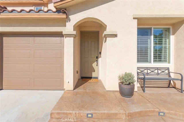 25499 Foxglove Ln, Corona, CA 92883 - doorway to property with a garage and stucco siding